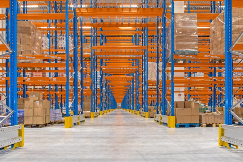 Warehouse with neatly stacked pallets, showcasing OLIMP's flexible freight storage and warehousing services for short-term and long-term needs.