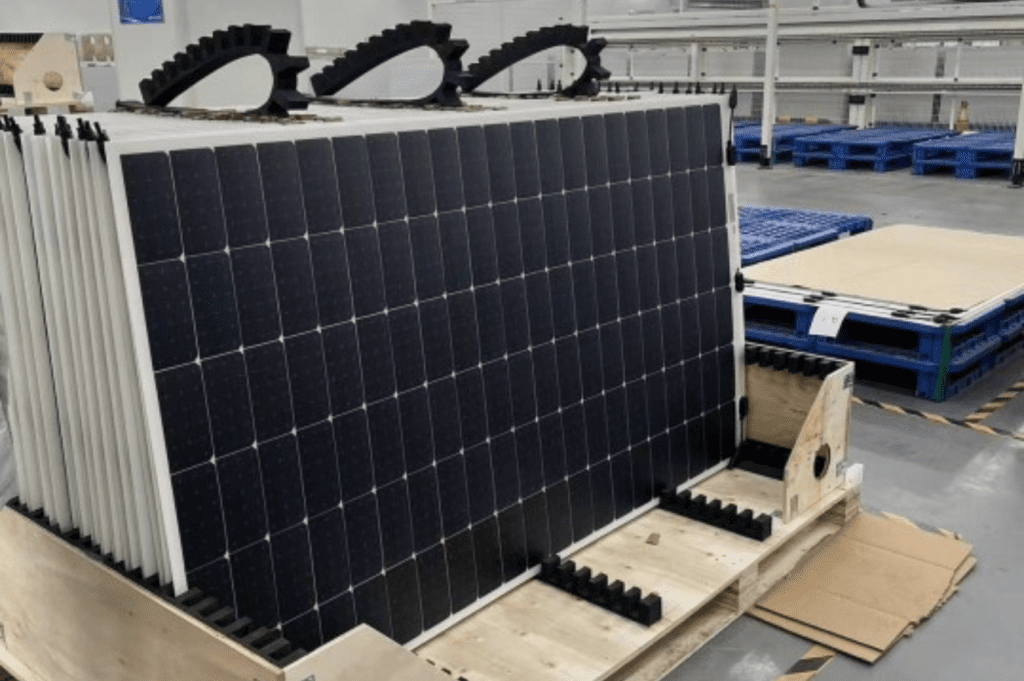 Solar panels neatly arranged on a double wide pallet, showcasing efficient storage solutions by a solar panel warehousing company.