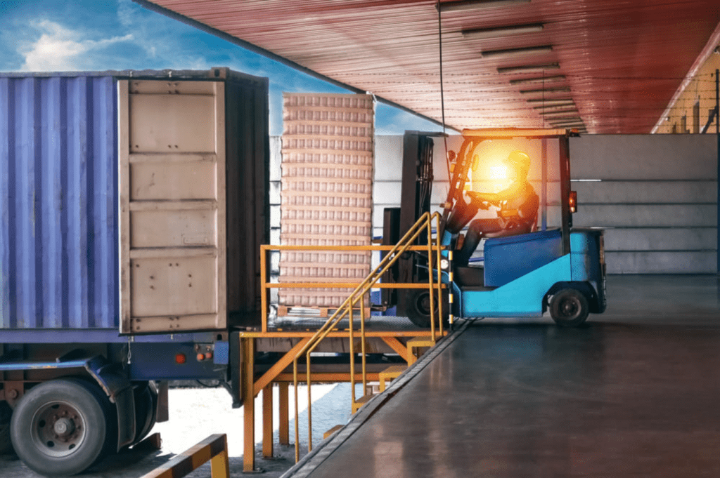 Denver warehouse staff supervising palletized commercial shipments.