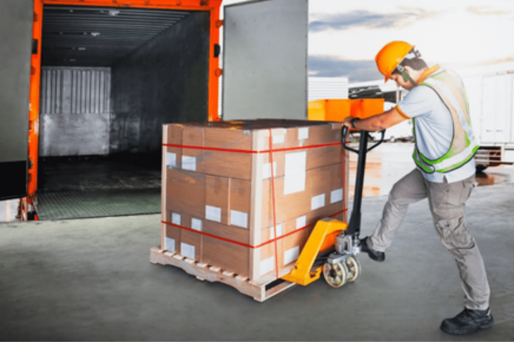Forklift handling palletized freight during refrigerated cross docking in Memphis, TN.