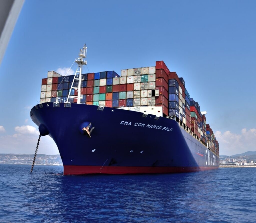 Professional warehouse team efficiently transferring cargo between trucks and rail cars at Olimp Warehousing's Milwaukee transloading facility.