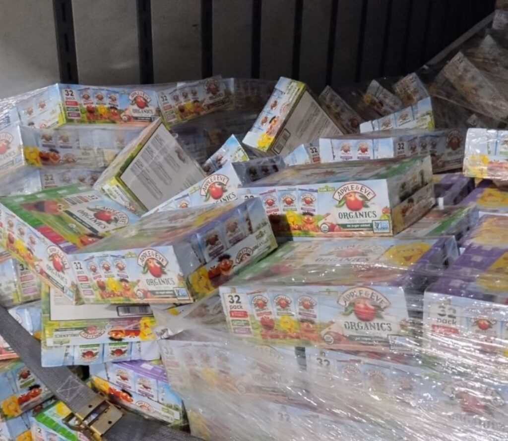 Technician reworking damaged pallets in Dayton OH warehouse