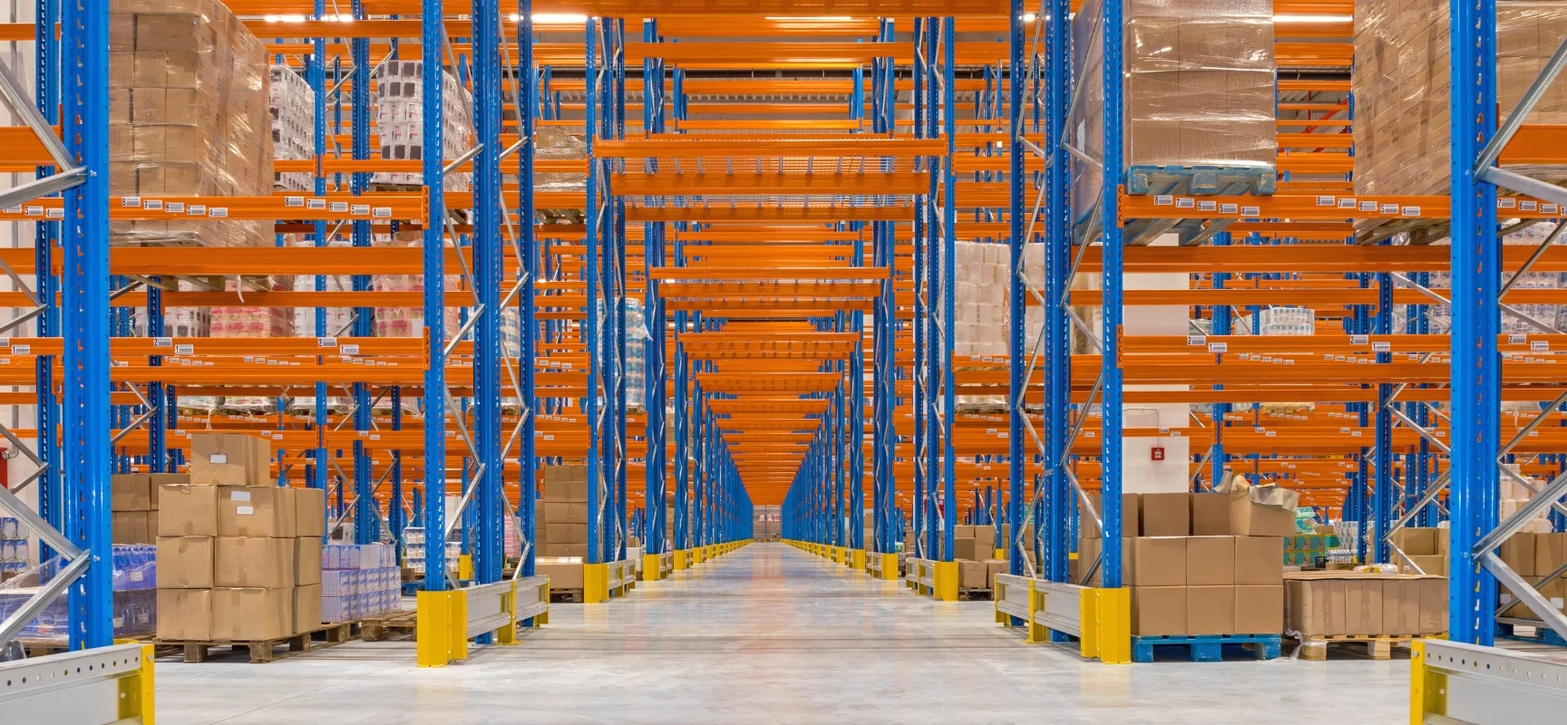 An efficient warehouse uses handheld scanners and organized shelving to speed up pick-and-pack operations.