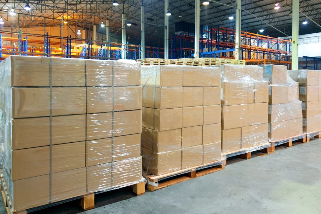 Interior view of a local warehouse for ecommerce, featuring organized shelves stocked with various packaged goods ready for shipment.