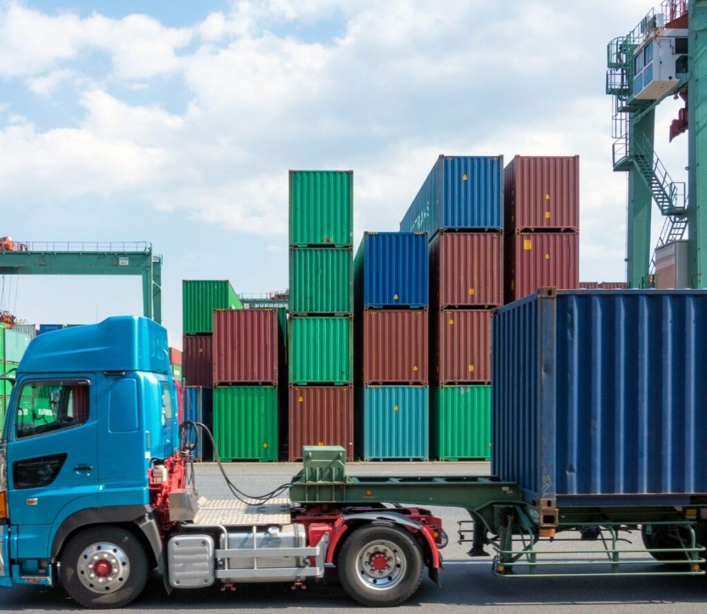 Container truck transporting freight from Dallas Container Terminal with OLIMP drayage services.
