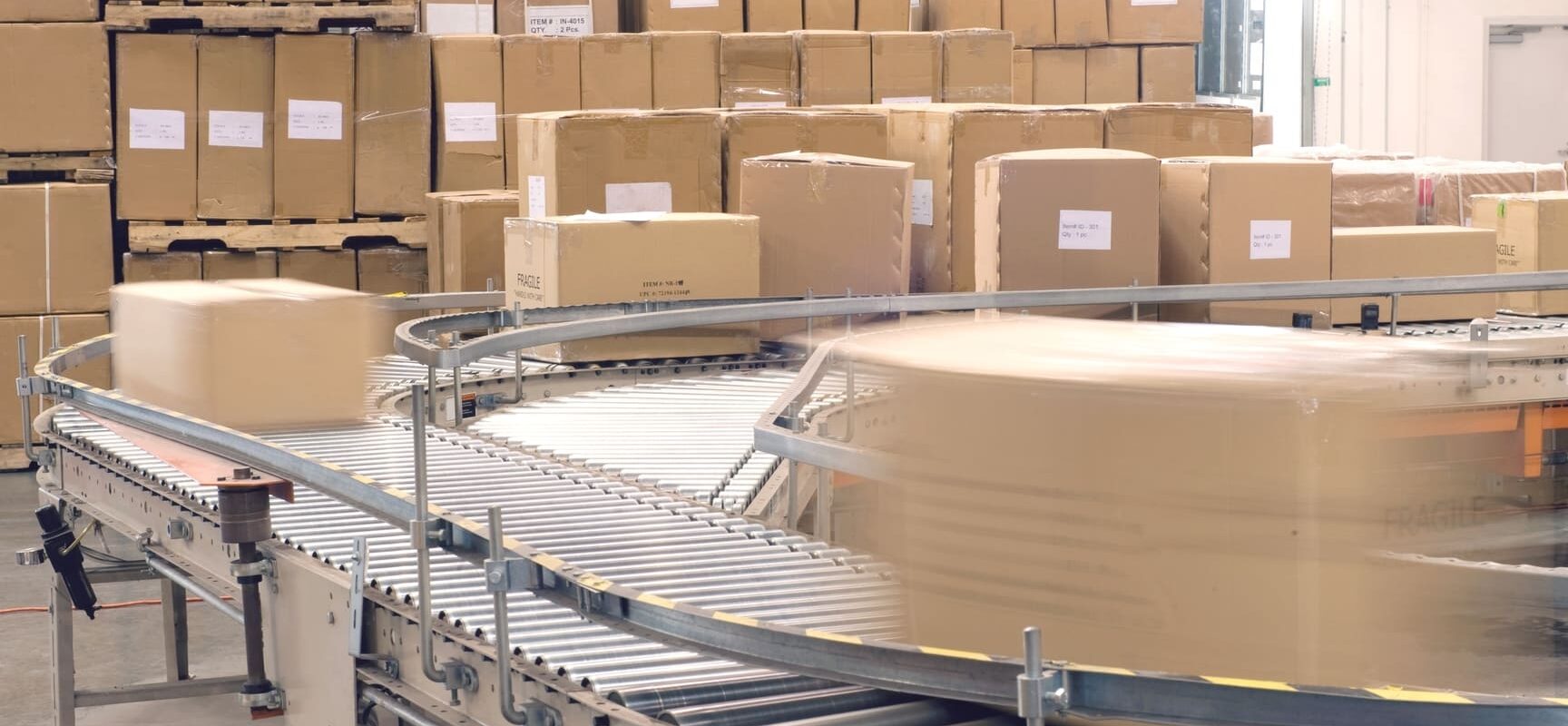Warehouse staff picking and packing eCommerce orders in a modern fulfillment center to prepare for shipping and delivery.