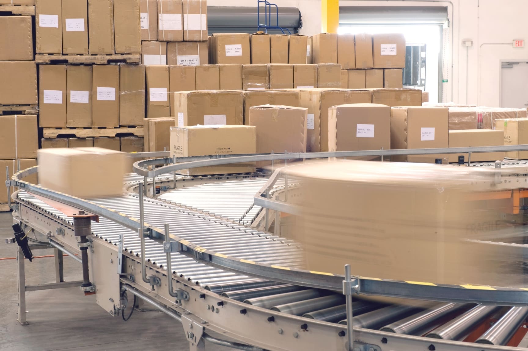 Warehouse staff picking and packing eCommerce orders in a modern fulfillment center to prepare for shipping and delivery.