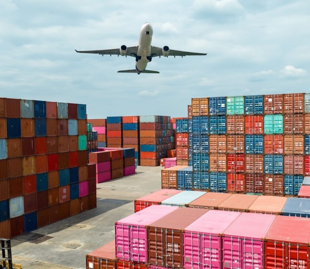 Airplane and stacked cargo containers symbolizing OLIMP’s international import and export warehousing and transloading services in Tampa.