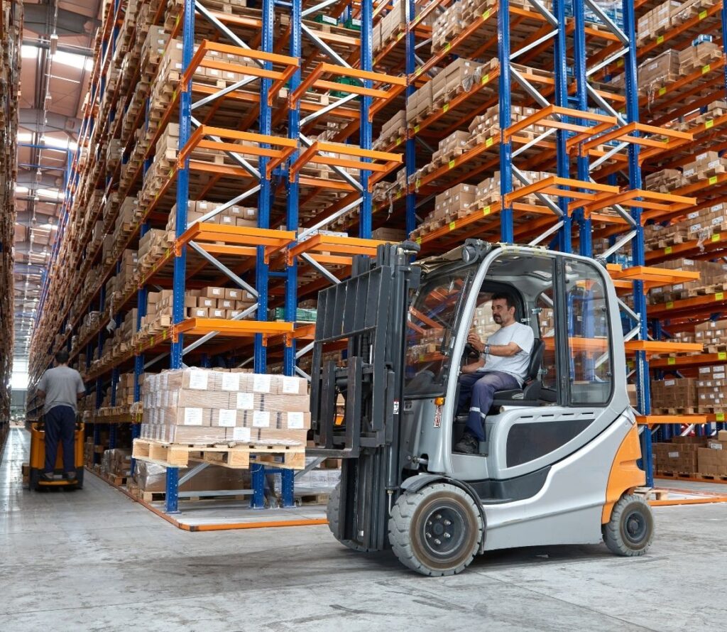 Trucks unloading and loading at OLIMP Stratford cross-docking warehouse near I-95