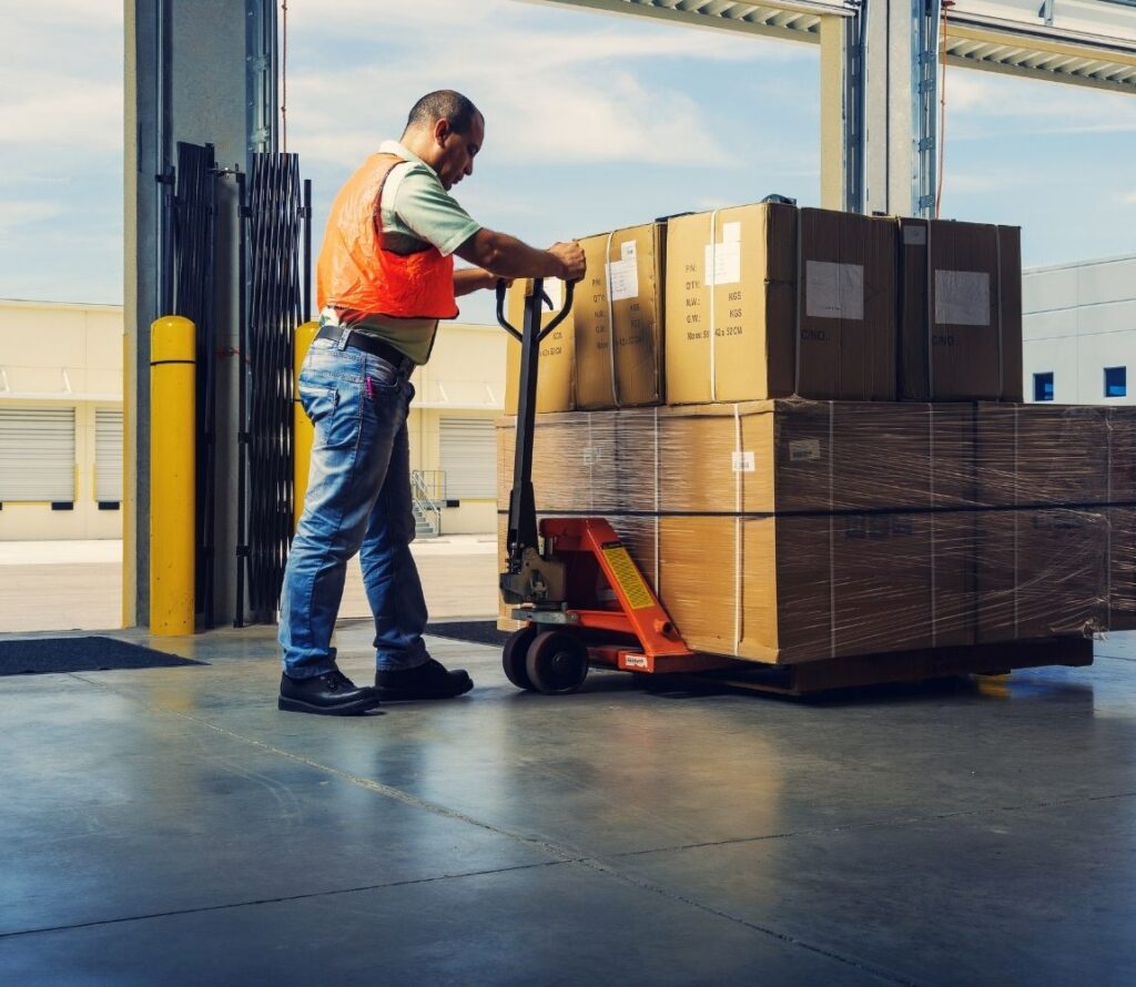 Damaged pallets being repaired and wrapped in Regina warehouse