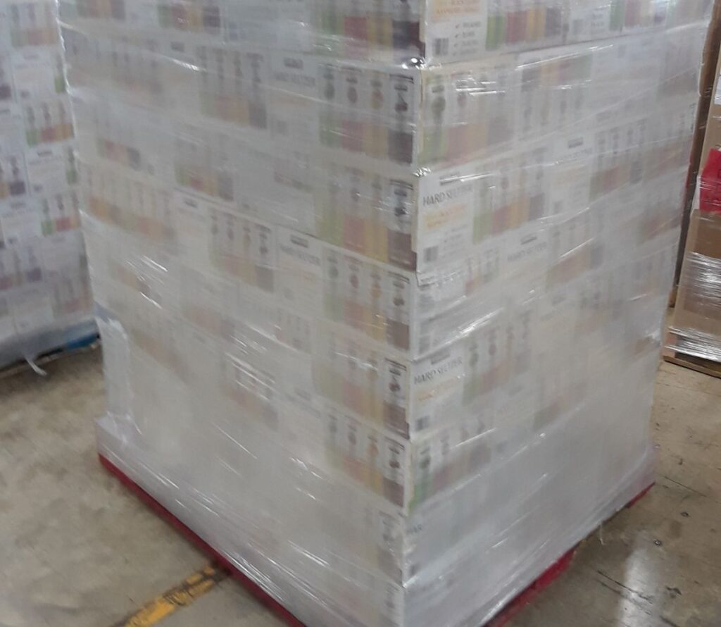 During transport, products scattered on pallets are safely reorganized and prepared for secure shipment through pallet rework services.