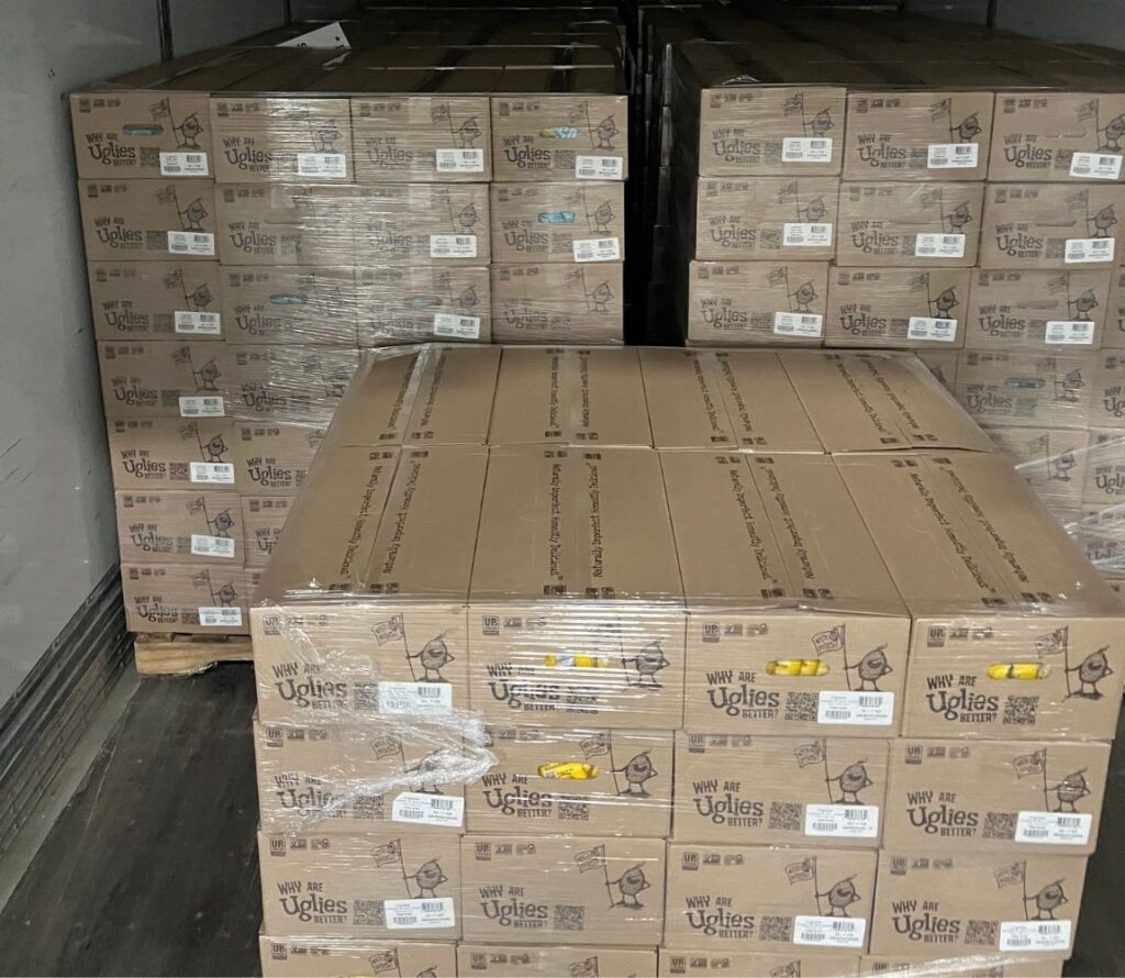 OLIMP Warehousing team performing pallet rework to ensure safe and stable shipments