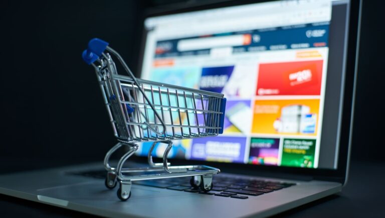 Visual of digital shopping experience with cart on laptop, representing Gen Z’s role in driving online retail trends.
