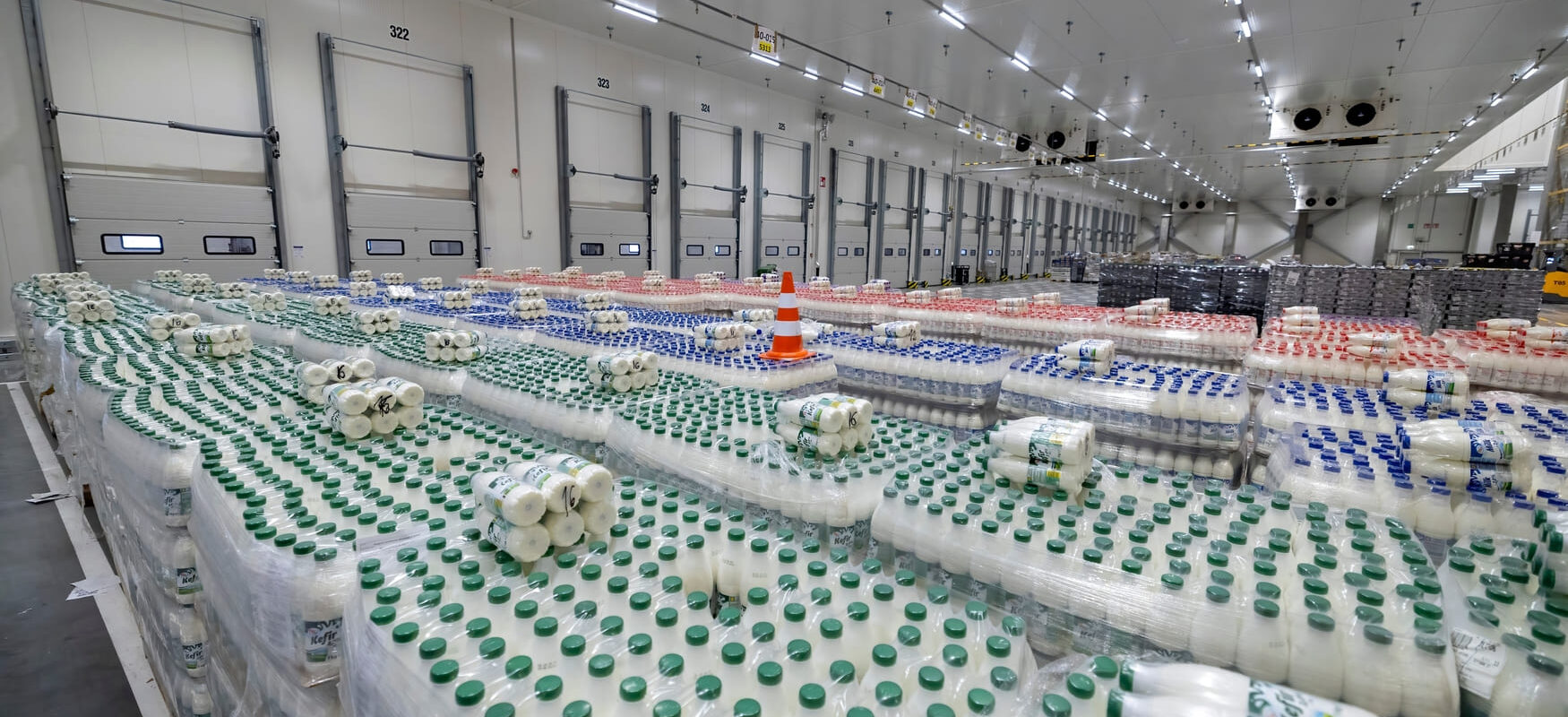 Pallets of dairy products stored in a temperature-controlled warehouse facility.