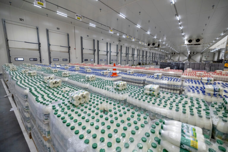 Pallets of dairy products stored in a temperature-controlled warehouse facility.