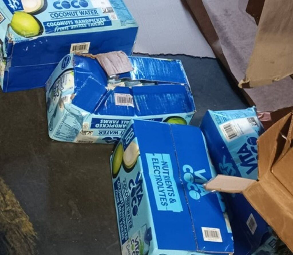 Warehouse staff performing pallet restacking to optimize storage space