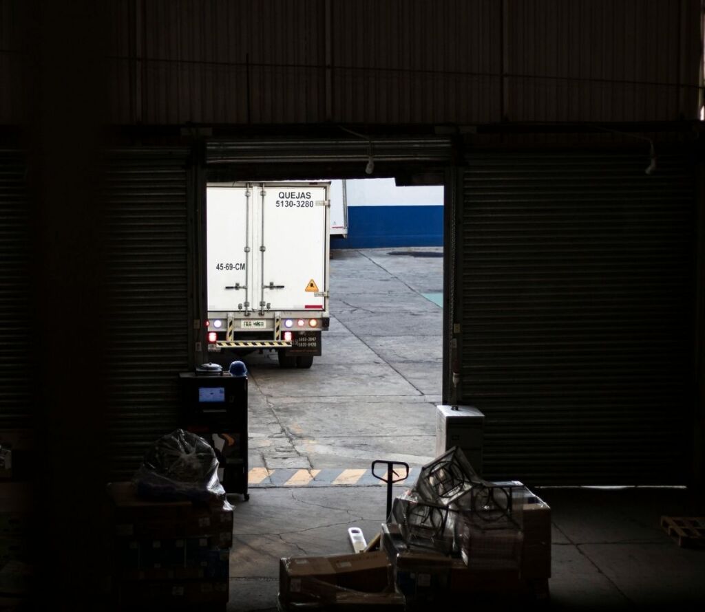 Professional warehouse team handling incoming and outgoing goods with cross dock expertise