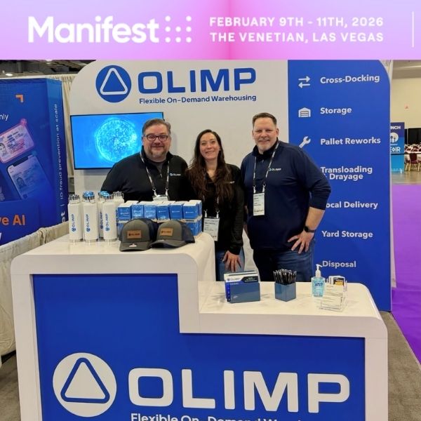 OLIMP Warehousing team networking with logistics professionals at Manifest Conference booth