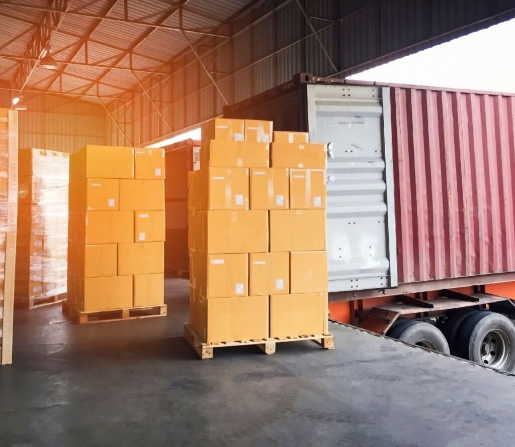 Palletized goods being routed quickly through a cross dock logistics warehouse