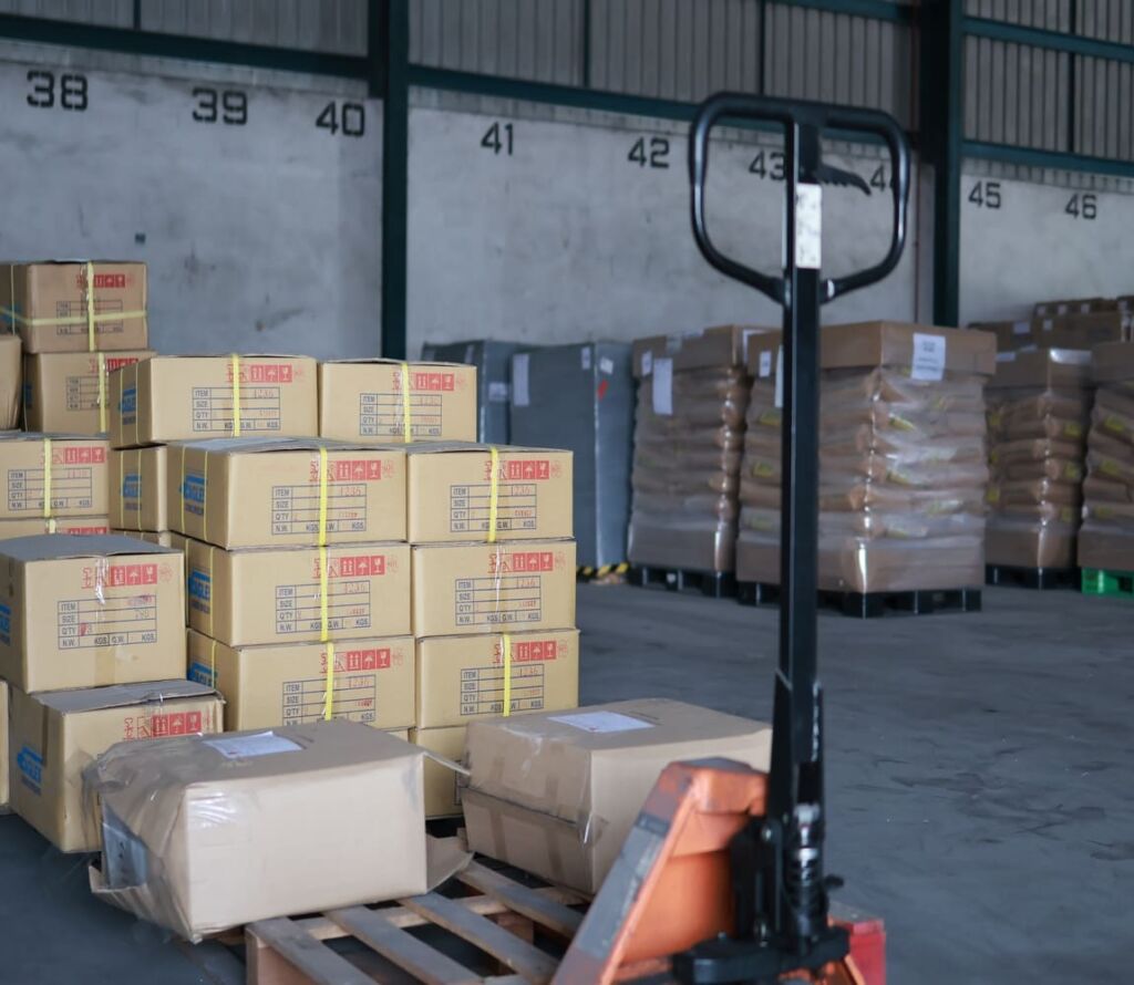 Warehouse workers reorganizing pallets for safe transport in Elkton MD