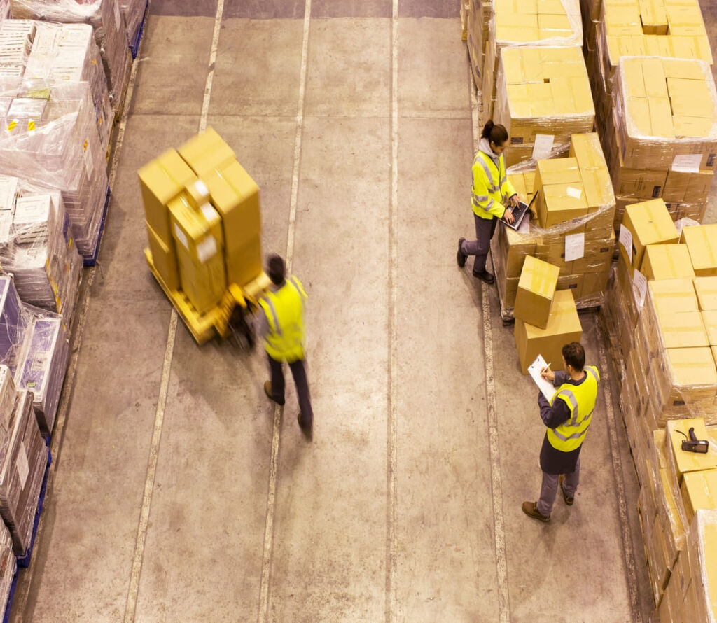 Warehouse workers reorganizing pallets for safe transport in Hagerstown MD