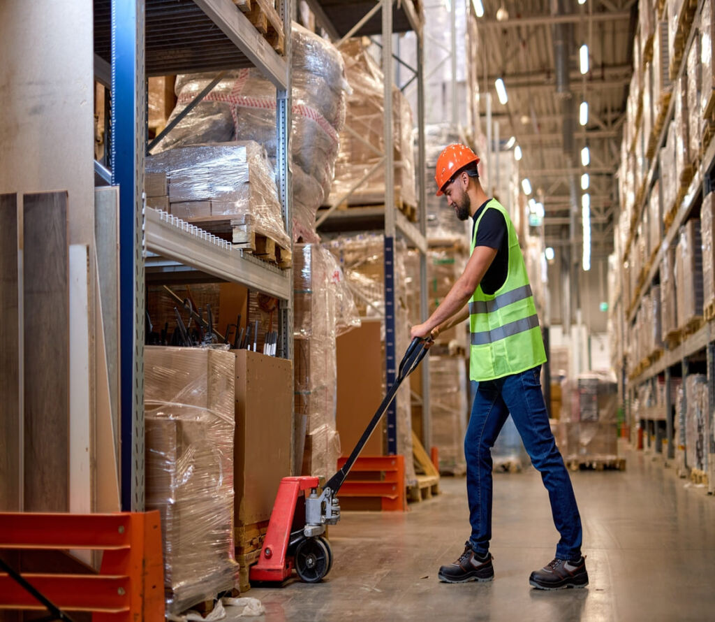 Warehouse workers reorganizing pallets for safe transport in Jessup MD