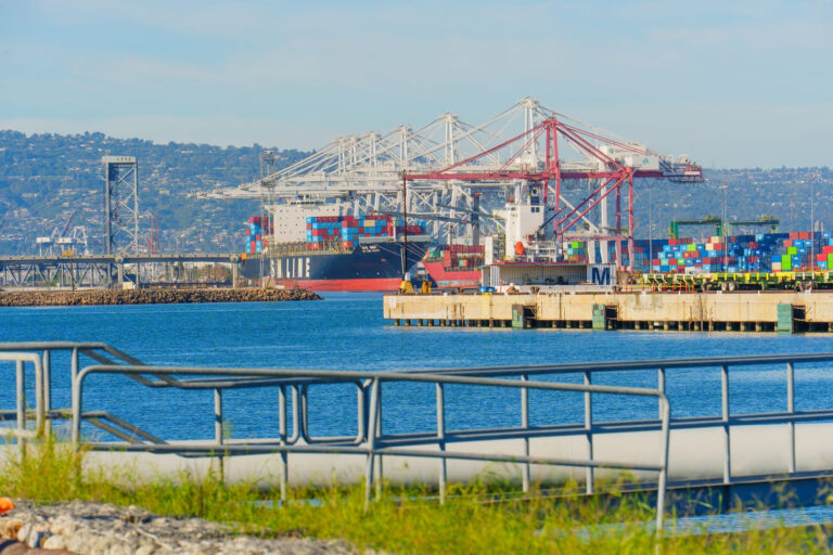 Container ship and cranes at the Port of Long Beach, showing California logistics and freight shipping operations.