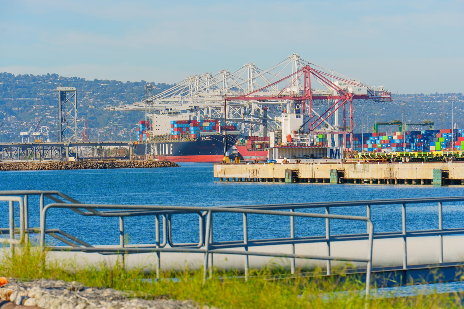 Container ship and cranes at the Port of Long Beach, showing California logistics and freight shipping operations.