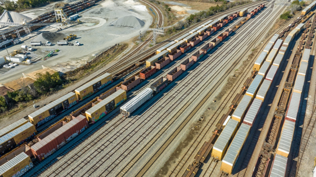 Aerial view of freight trains and rail yards in Jacksonville, highlighting the city’s intermodal logistics and cargo transportation network.  